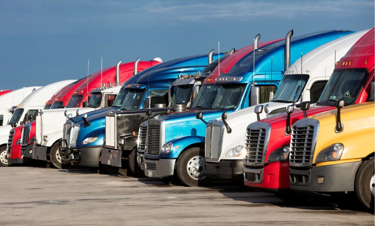 Semi-trucks parked at a truck stop